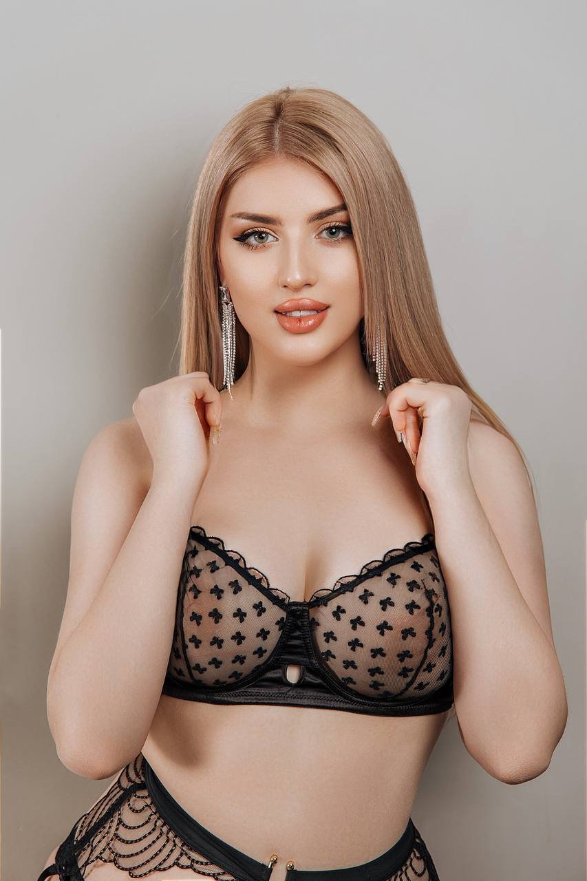 Brunette escort smiling confidently